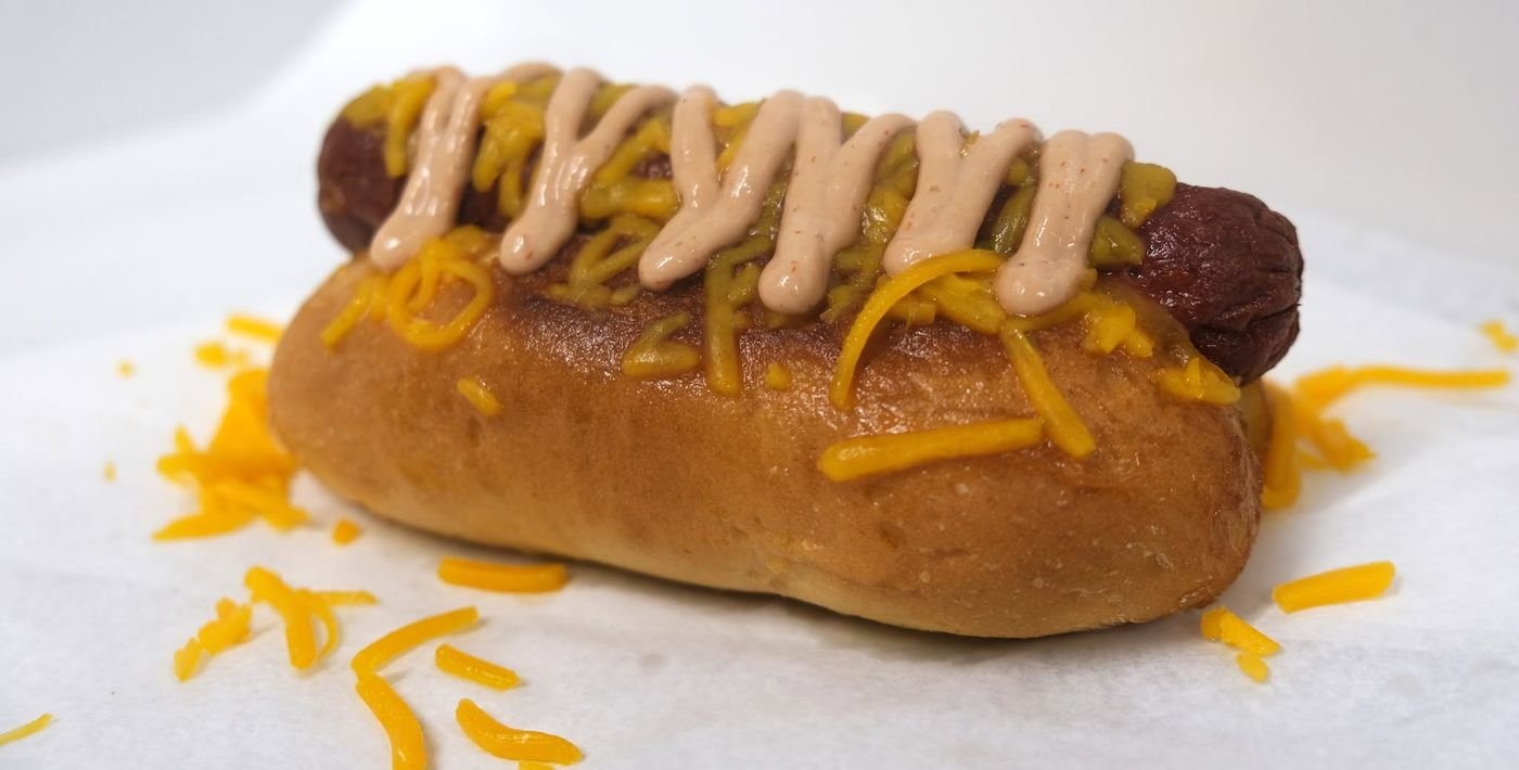 Big Dog smothered in cheddar and Stacker Sauce