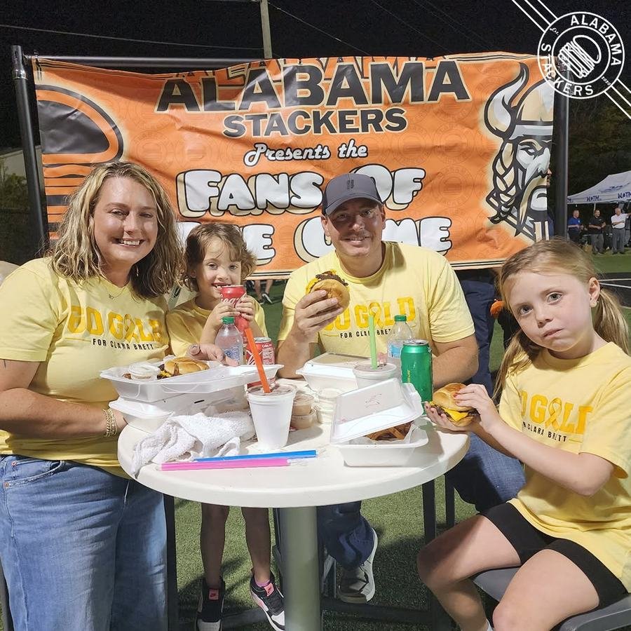 A family eating burgers at Alabama Stackers